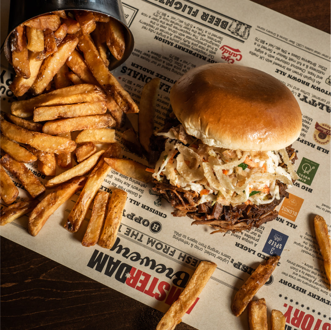 Smoked Brisket Sandwich at Amsterdam Brewhouse, perfect for a rooftop dining experience with lakeside views.